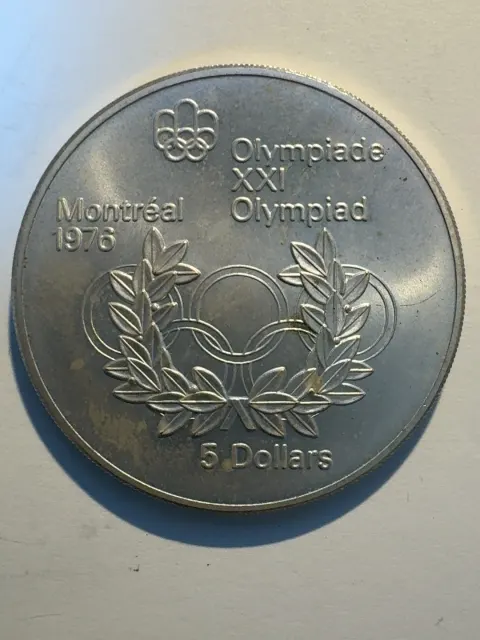 5 долара „Олимпийски игри Монреал 1976 – Олимпийски кръгове и лавров венец“